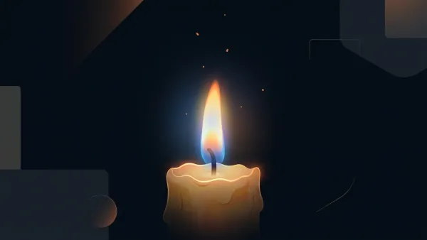 A single candle flame glowing against a dark background — the simplest example of the science of fire